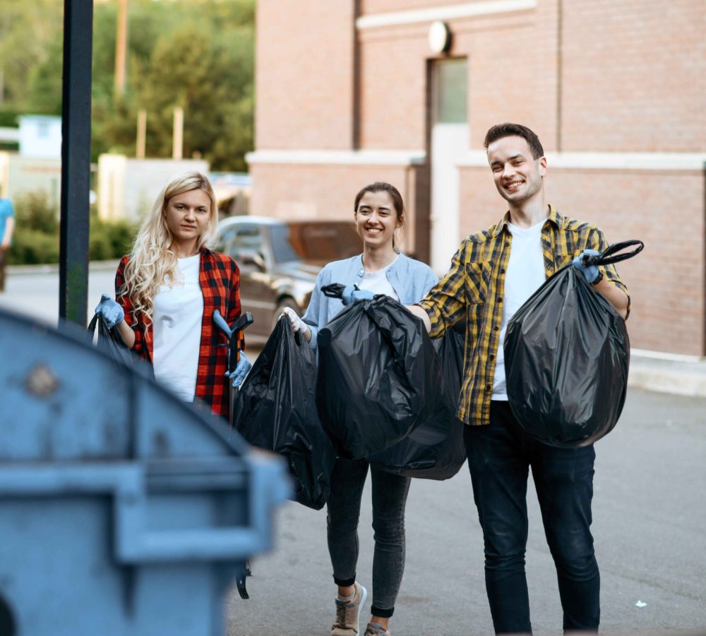 volunteers-holds-plastic-trash-bags-outdoors-2024-11-26-19-44-27-utc (1)